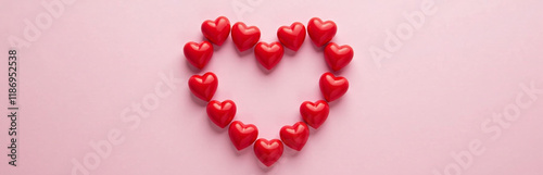 A Heart Shape Made Of Red Hearts Is Positioned In The Center Of A Pink Background Leaving Space To Add Text. 00001