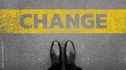 Embracing Change: A Powerful Journey Towards Transformation Illustrated by a Pair of Shoes Standing on a Yellow Marked Word CHANGE in an Urban Environment. photo