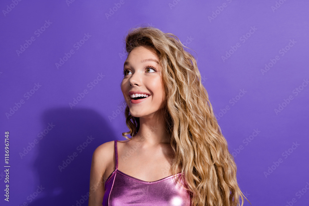 Photo of pretty young girl look empty space ad wear shiny top isolated on violet color background