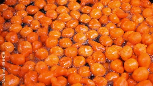 Fresh gulab jamun are being sold in a village fair, Making of Gulab Jamun in street side, delicious indian sweet gulab jamun 