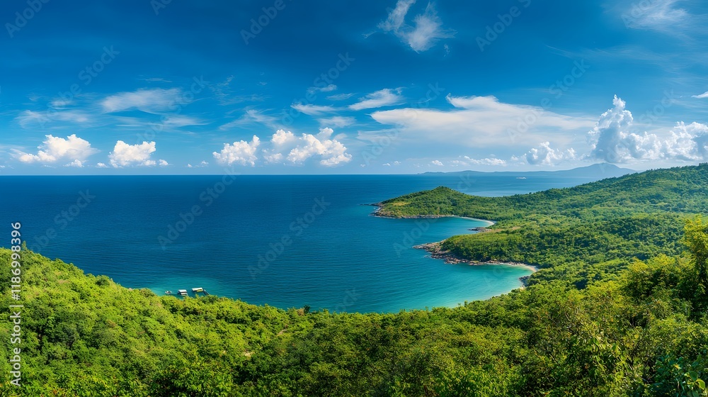 Naklejka premium Lush Green Tropical Coastline Meets Azure Ocean Under Blue Sky