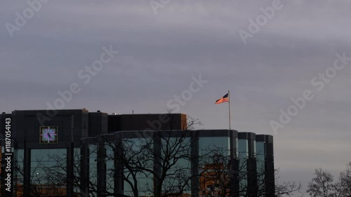 waving flag at the top of a building