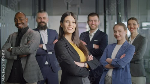 Confident business team posing together in modern office environment, showcasing leadership, teamwork, and diversity. Concept of corporate unity and professional collaboration