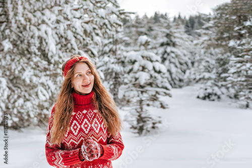 Happy Woman in Snow Covered Winter Forest