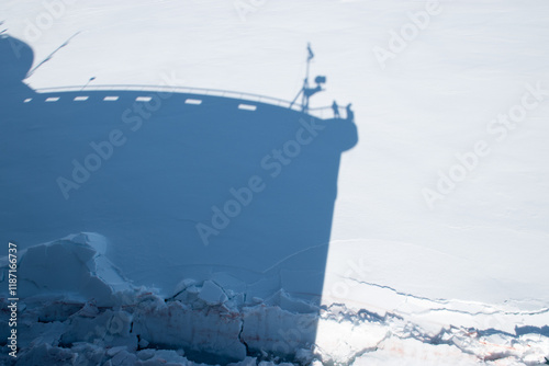 Photos Shadow of an ice breaking cruise ship in the snowy ice of the frozen sea