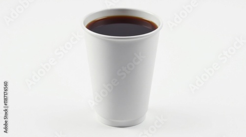 A tall disposable cup filled with dark coffee sits on a plain white background. This image is perfect for illustrating concepts related to beverages, refreshment, or everyday routines.