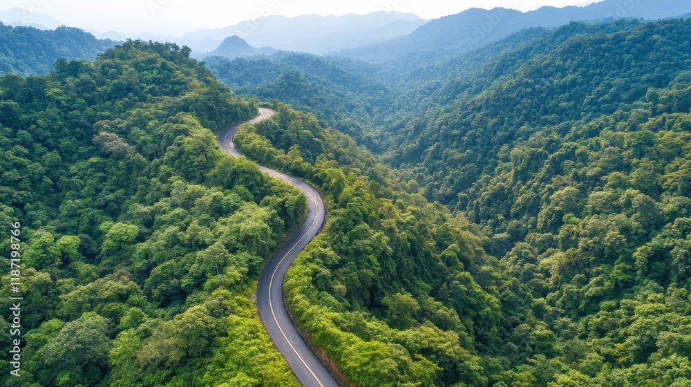 Scenic winding road through lush green hills Scenic winding road through lush green hills