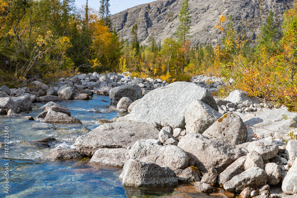 View to Mannepakhp river at Khibiny mountains. Early autumn in arctic tundra region. Kola peninsula, Murmansk region, Russia.