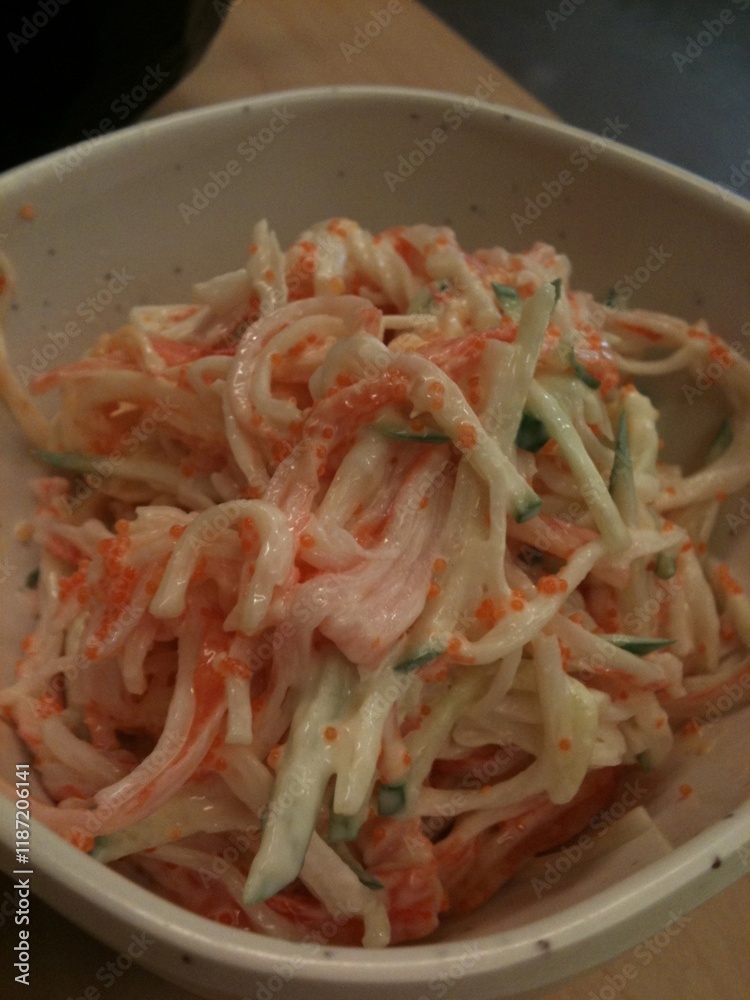 Crab stick and Cucumber slice salad topped with shrimp eggs Crab stick and Cucumber slice salad topped with shrimp eggs