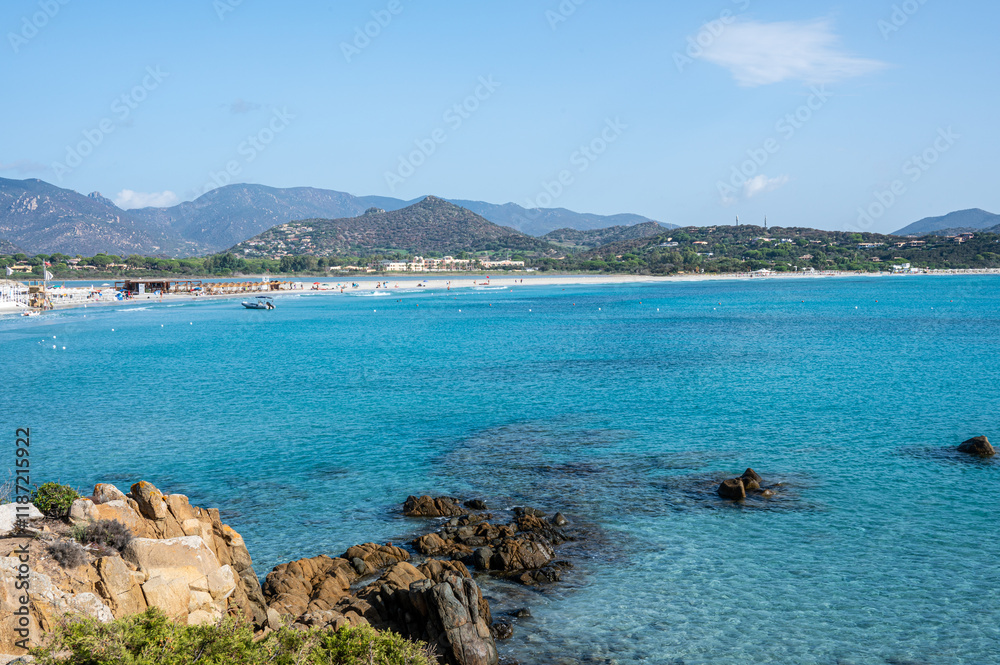 VIllasimius, Italy - 09-05-2024: Aerial view of the beautiful beach of Porto Giunco in Villasimius with white sand and crystal clear water with the Notteri pond in the background VIllasimius, Italy - 09-05-2024: Aerial view of the beautiful beach of Porto Giunco in Villasimius with white sand and crystal clear water with the Notteri pond in the background