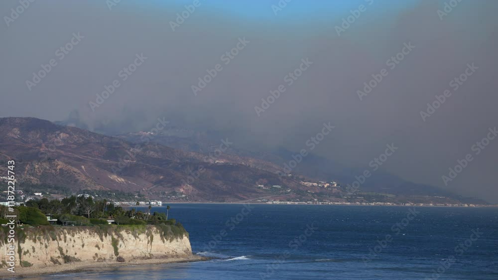 Destructive wildfire in Malibu, California on 01.07.2025, Smoke from fire cover Malibu coast, Many homes are lost, firefighters heroically battle flames, facing hazardous conditions from heavy smoke Destructive wildfire in Malibu, California on 01.07.2025, Smoke from fire cover Malibu coast, Many homes are lost, firefighters heroically battle flames, facing hazardous conditions from heavy smoke
