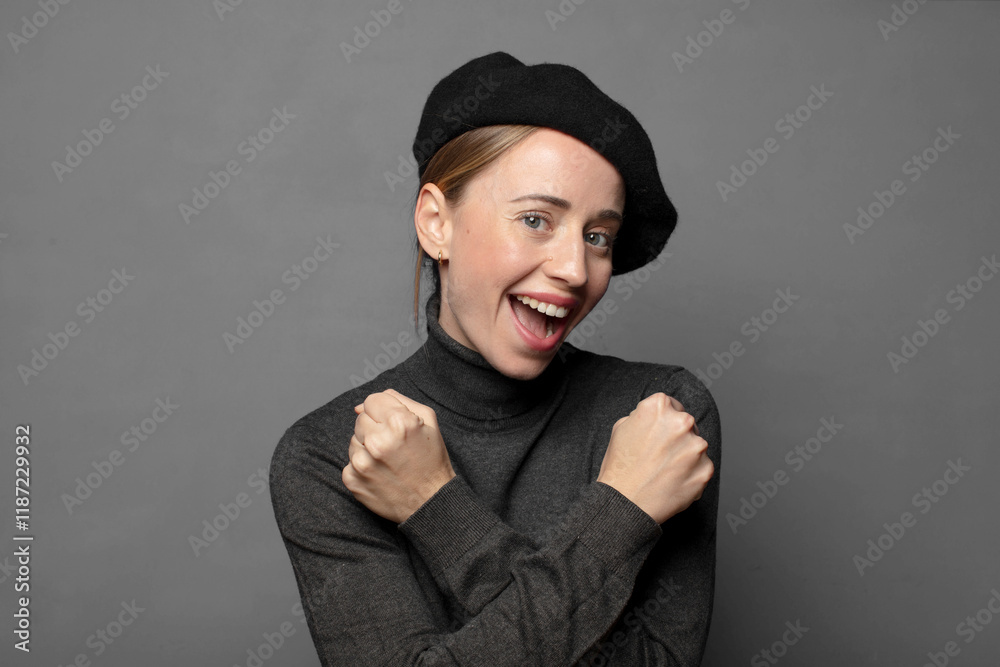 smiling cheerfully and celebrating, with fists clenched and arms crossed, feeling happy and positive smiling cheerfully and celebrating, with fists clenched and arms crossed, feeling happy and positive
