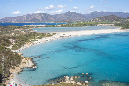 Obraz na płótnie VIllasimius, Italy - 09-05-2024: Aerial view of the beautiful beach of Porto Giunco in Villasimius with white sand and crystal clear water with the Notteri pond in the background w salonie