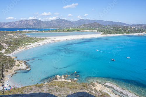 Obraz na płótnie VIllasimius, Italy - 09-05-2024: Aerial view of the beautiful beach of Porto Giunco in Villasimius with white sand and crystal clear water with the Notteri pond in the background w salonie