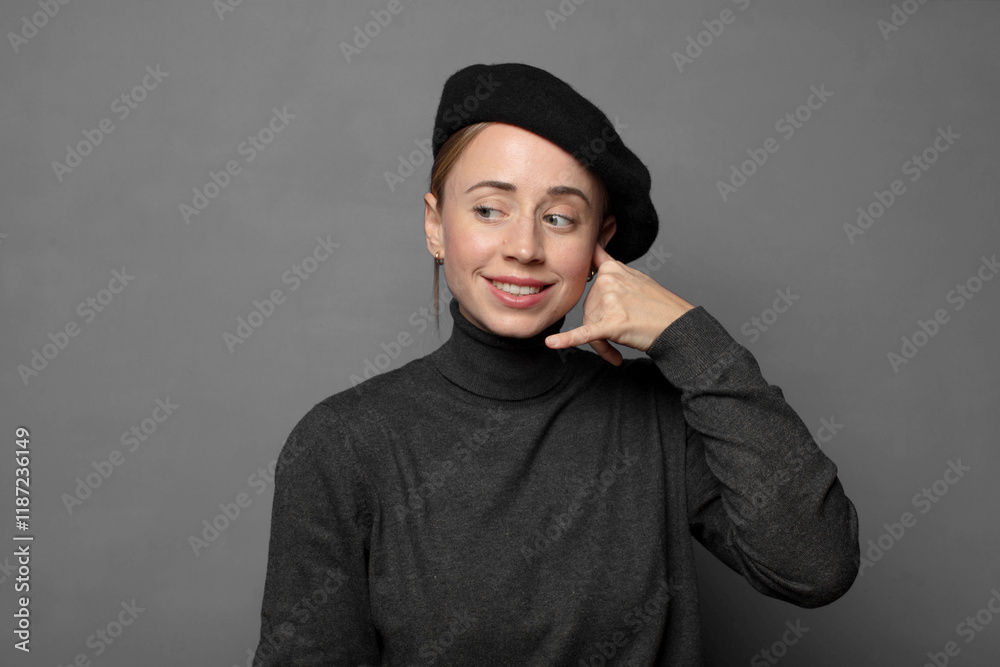 smiling cheerfully and pointing to camera while making a call you later gesture, talking on phone smiling cheerfully and pointing to camera while making a call you later gesture, talking on phone