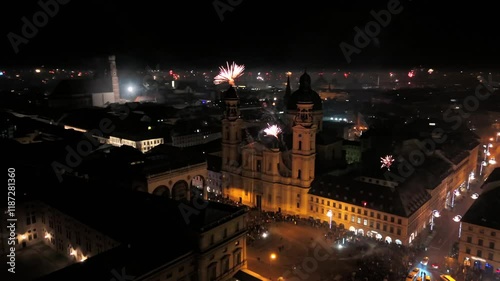 Silvester Muenchen, Deutschland, Odeonsplatz Luftaufnahme. Aerial view of Munich, Germany, showcasing vibrant New Years Eve fireworks display over city center. Stadt versinkt im Funkenregen. Salute.  photo