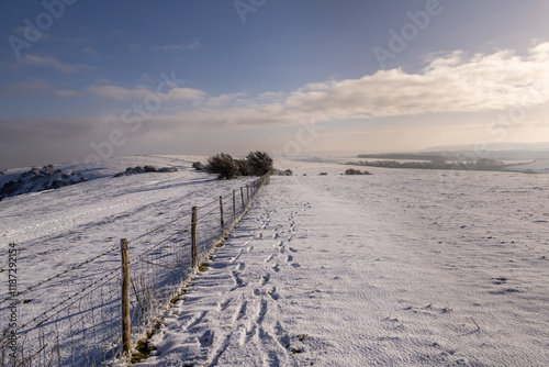 A sunny morning on a snowy Ditchling Beacon in the South Downs photo