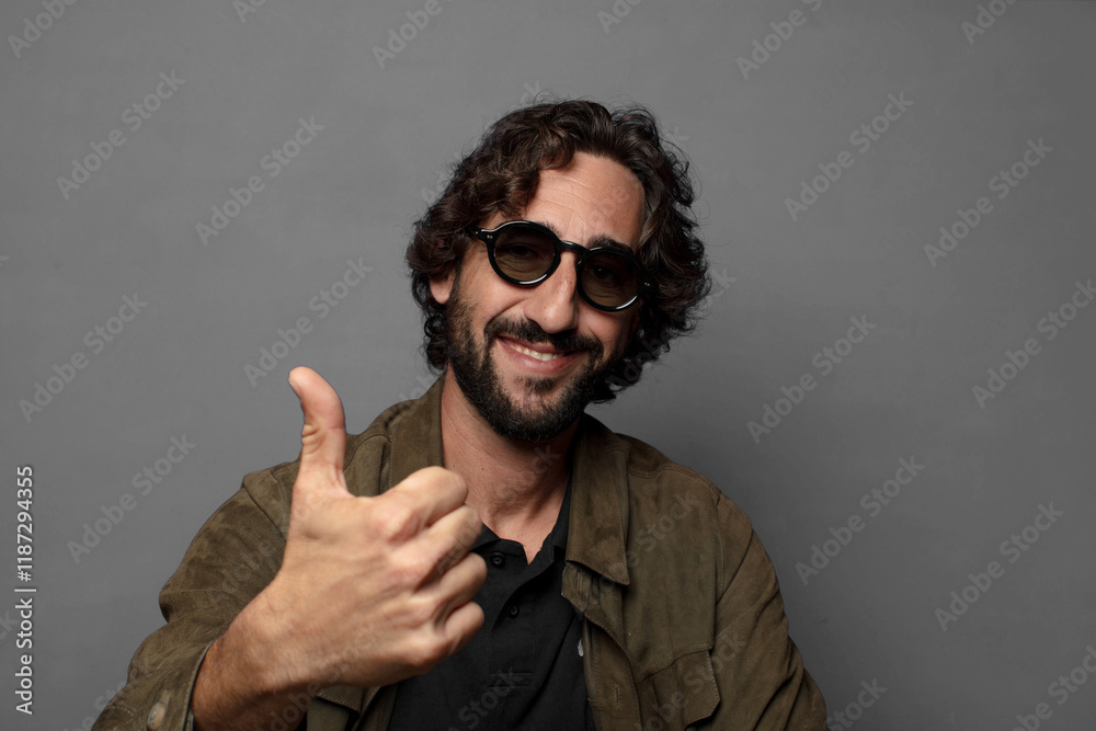 young bearded man wearing sun glasses young bearded man wearing sun glasses