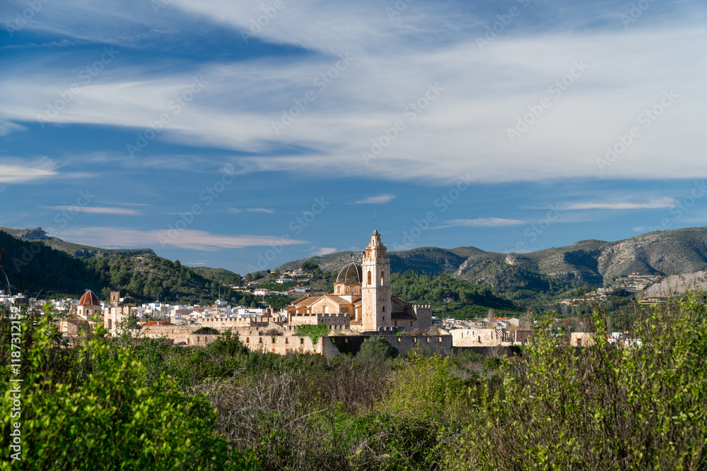 Naklejka premium Landscape with a village on background, Simat de la Valldigna, Comunidad Valenciana (Spain).
