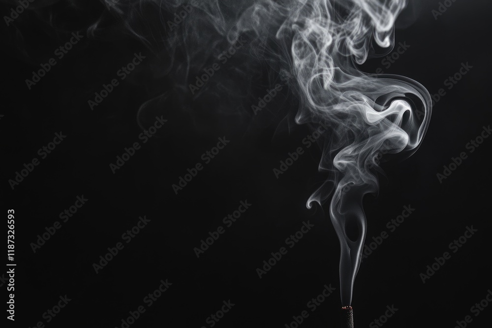 Monochrome incense smoke on dark background for graphic design.