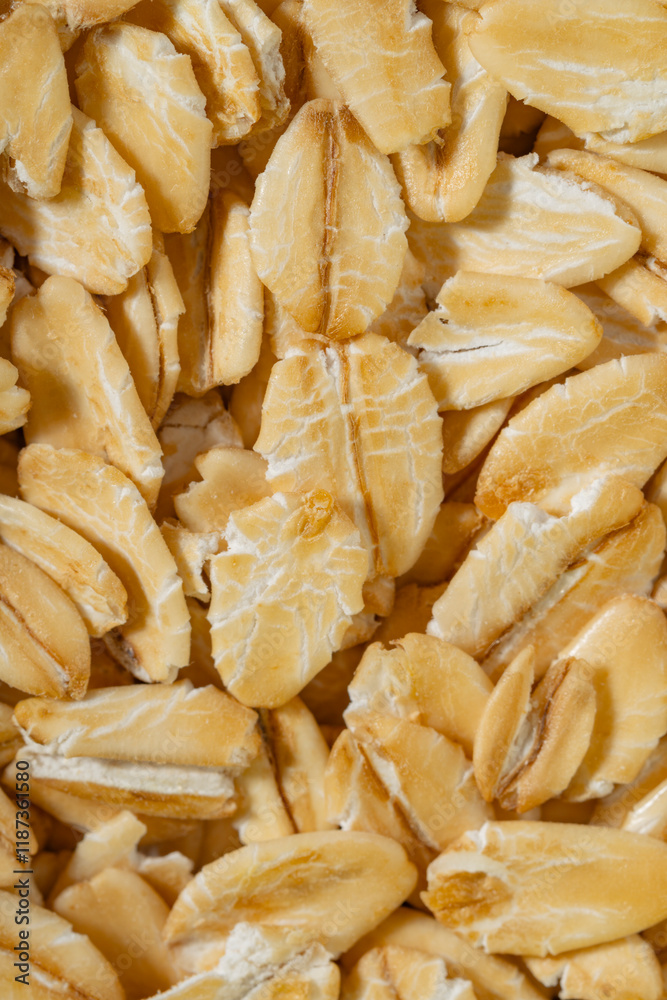 Macro Close-Up of Raw Rolled Oats Highlighting Natural Texture Close up photo of oat flakes, selective focus, food background. Macro Close-Up of Raw Rolled Oats Highlighting Natural Texture Close up photo of oat flakes, selective focus, food background.