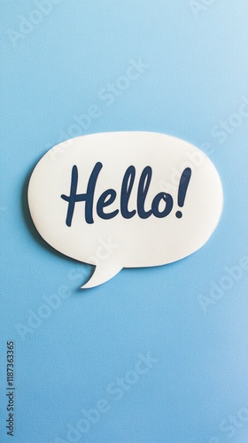 White speech bubble with the word hello written in blue sits on a light blue background, representing communication, greeting, and online messaging