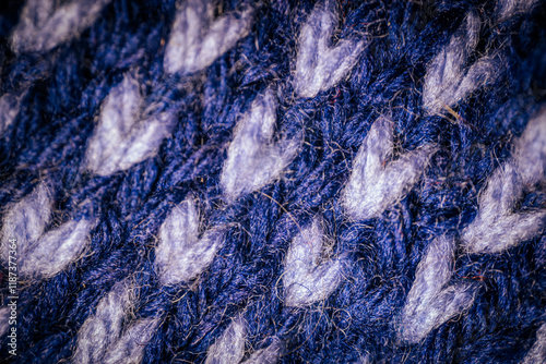 Wallpaper Mural A macro view of blue knitted fabric with a repeating white pattern, highlighting the intricate stitching and soft texture. The design creates a cozy and artistic feel. Torontodigital.ca