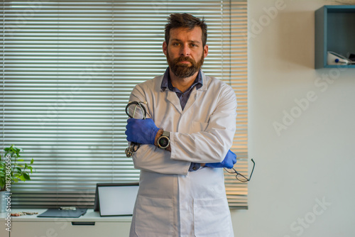 Close up portrait of handsome Caucasian senior joyful male doctor infectionist in white coat sitting in cabinet in clinic at work talking on video call online through webcam with patient medic concept photo