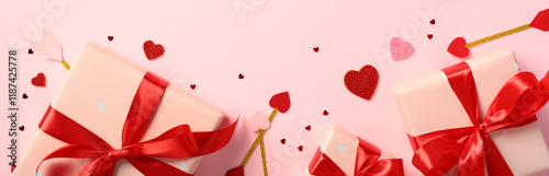 Valentine's Day gifts wrapped in pink paper with red ribbons, surrounded by red and pink hearts and Cupids arrows on a pastel pink background. Perfect for romantic holiday themes and celebrations photo