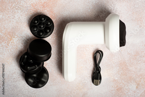 Electric massager for body with nozzles isolated on white background. photo