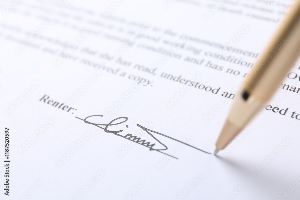 Pen leaving signature on contract, closeup view Pen leaving signature on contract, closeup view