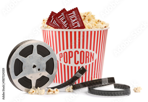 Tasty popcorn, film reel and movie tickets isolated on white