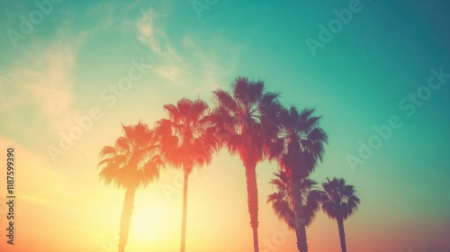 Colorful sunset illuminates the skyline of Los Angeles, with palm trees outlined in the foreground, creating a serene atmosphere
