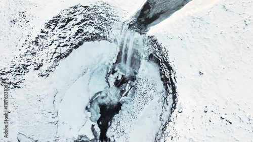 Waterfall in Iceland, Frozen river in winter, Magical location of snow and ice, Magical winter landscape in the northern country, Svodufoss photo