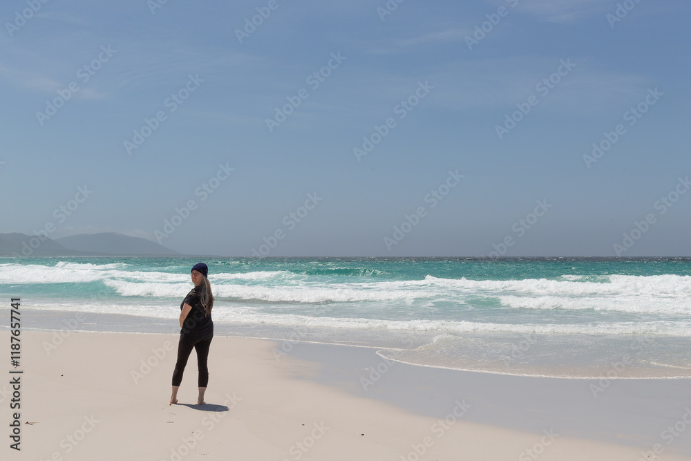 Outdoor view of Friendly Beaches with single female on the east coast of Tasmania Outdoor view of Friendly Beaches with single female on the east coast of Tasmania