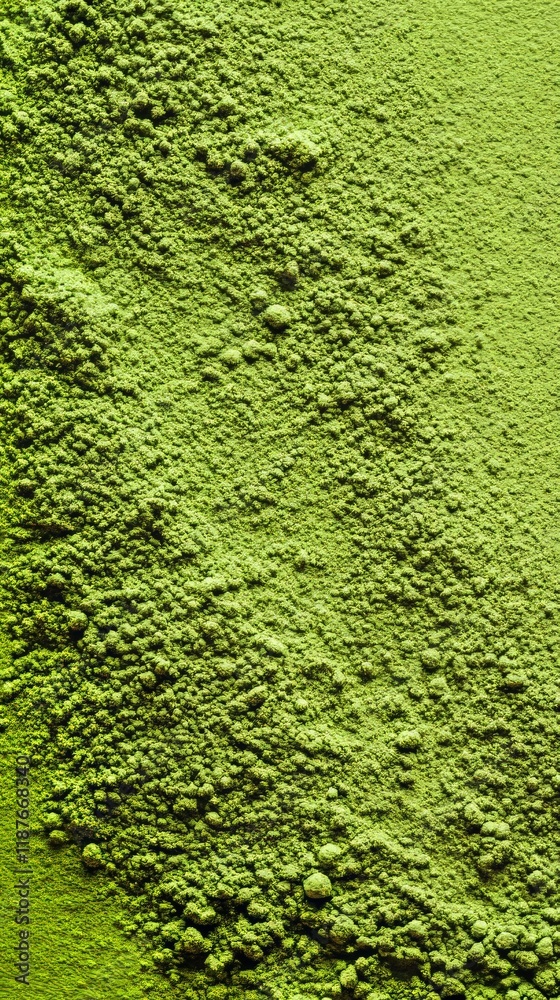 Vibrant green matcha tea powder textured surface close-up Vibrant green matcha tea powder textured surface close-up