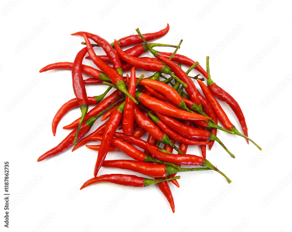 Stack red chili peppers and basil herb leaves on the white Stack red chili peppers and basil herb leaves on the white
