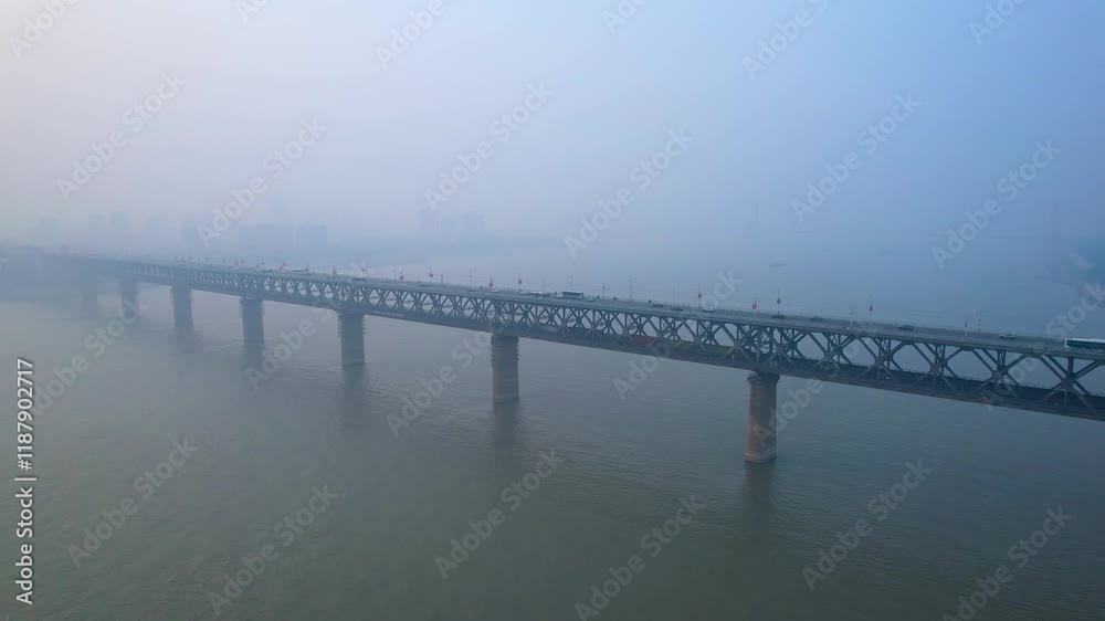 Breathtaking aerial view of Yangtze River Bridge in Wuhan showcasing stunning architecture and surrounding misty landscape Breathtaking aerial view of Yangtze River Bridge in Wuhan showcasing stunning architecture and surrounding misty landscape