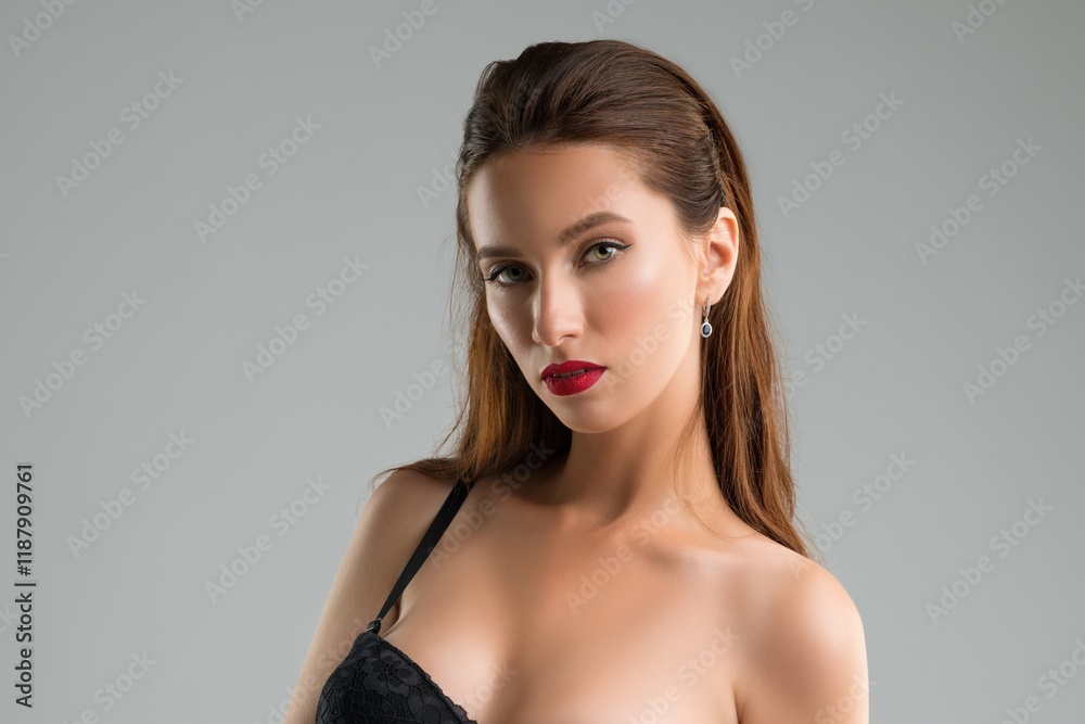 Fototapeta premium Stunning model poses gracefully with red lips and a confident expression