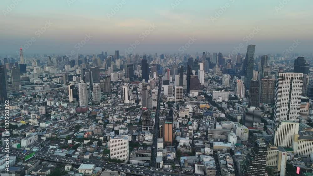 Bangkok high aerial view from the Chao Phraya River to Ratchathewi district at twilight. A large asian capital city with skyscrapers and millions of inhabitants. Cinematic 60fps 4k footage Bangkok high aerial view from the Chao Phraya River to Ratchathewi district at twilight. A large asian capital city with skyscrapers and millions of inhabitants. Cinematic 60fps 4k footage