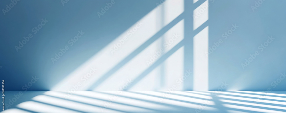 Fototapeta premium Soft blue interior with shadows creating a soothing atmosphere.