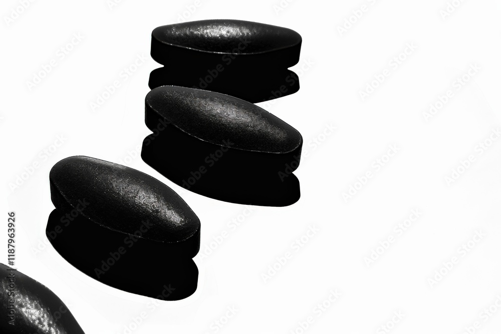 Silhouette of a vitamin pill: a simple depiction of vitality Silhouette of a vitamin pill: a simple depiction of vitality