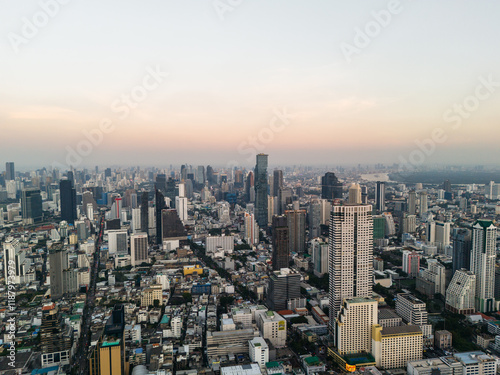 Bangkok high aerial view from the Chao Phraya River to Bang Rak and Si Lom districts at sunset. A large asian capital city with skyscrapers and millions of inhabitants. High quality panoramic photo photo