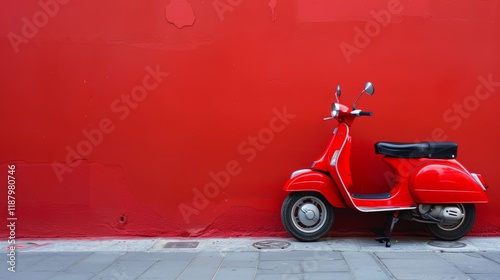 Bright red scooter against a vibrant red wall on city street