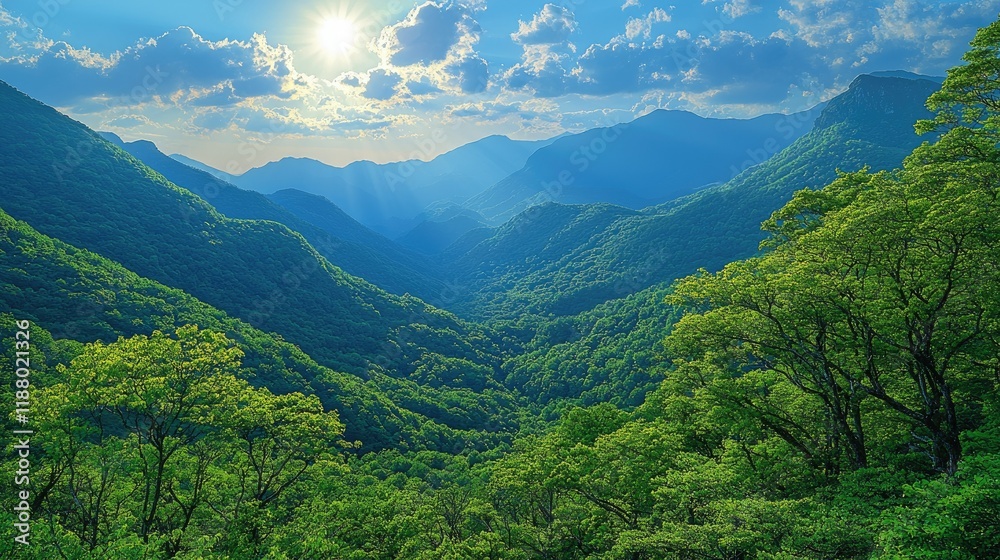 Fototapeta premium Sunlit Green Mountains Under a Blue Sky