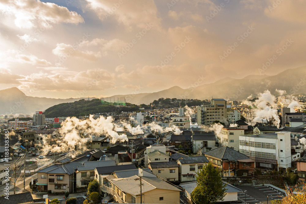 Beppu cityscape with Steam drifted from public hot spring baths and ryokan onsen background, Beppu, Oita, Kyushu, Japan.