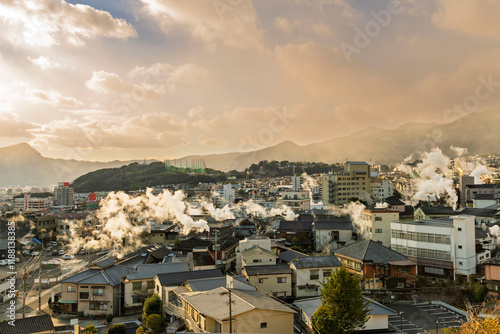 Beppu cityscape with Steam drifted from public hot spring baths and ryokan onsen background, Beppu, Oita, Kyushu, Japan. photo