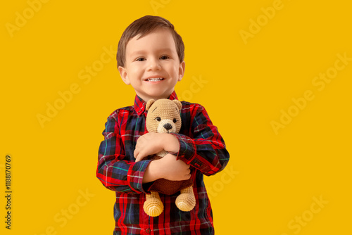 Cute little boy hugging toy...