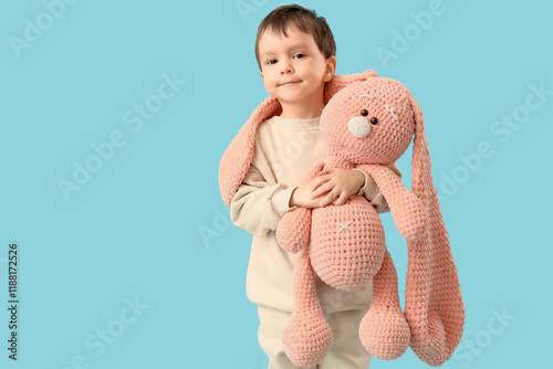 Cute little boy hugging toy...