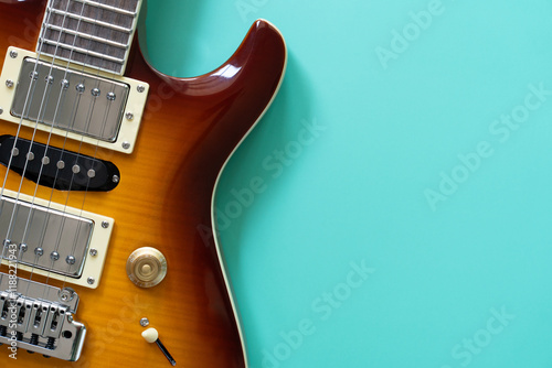 Canvas Print Electric guitar on green table background, flat lay, music instrument concept